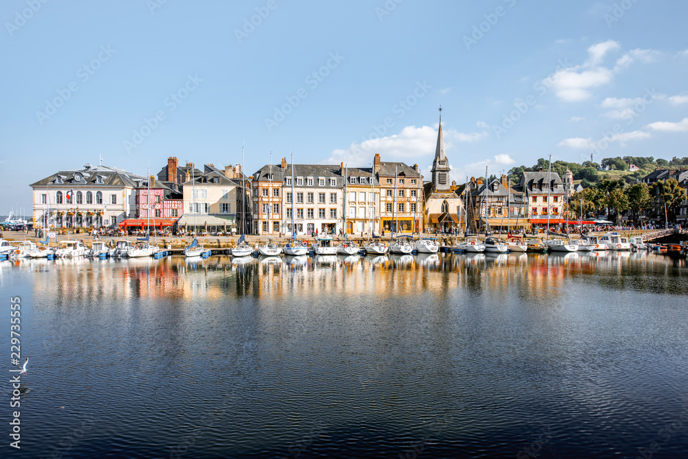 Landscape view on the beautiful harbour with yachts and old buildings in Honfleur, famous french town in Normandy