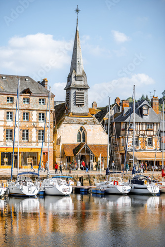 Canvas Print Waterside with ancient buildings and church in Honfleur, famous french town in N