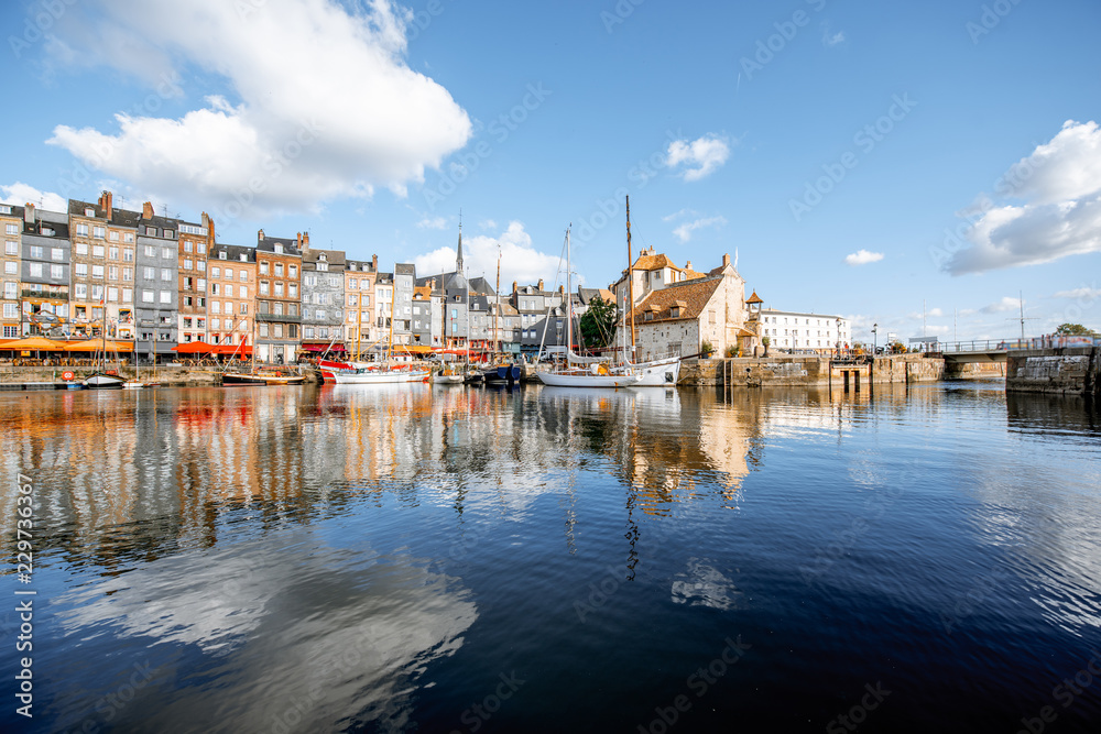 Fototapeta premium Landscape view of the harbour in Honfleur, famous french town in Normandy, during the morning light