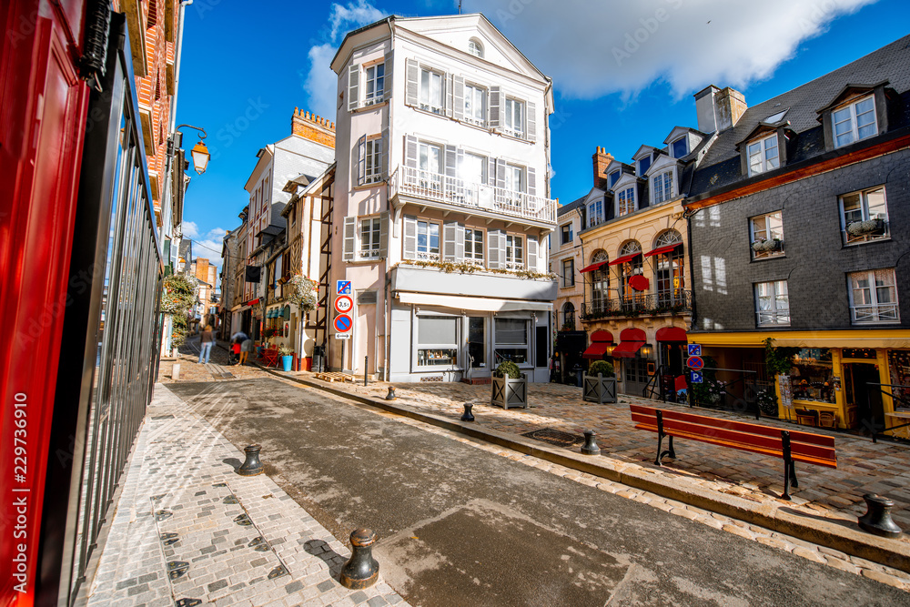 Street view with beautiful old buildings in Honfleur, famous french town in Normandy