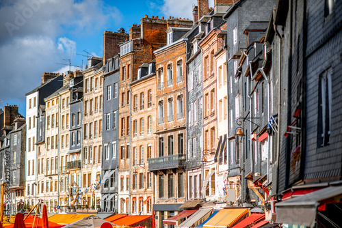 Beautiful facades of the old buildings at the harbour of Honfleur, famous french town in Normandy