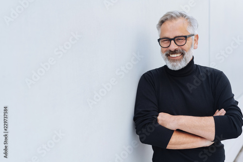Relaxed self-assured senior man with beard