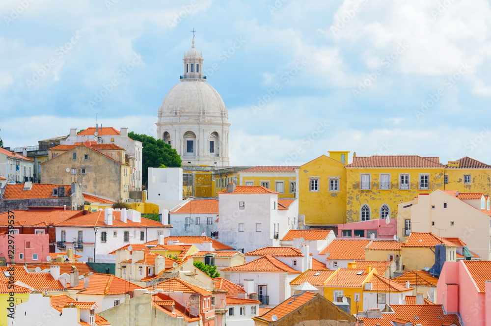 View to Lisbon houses with roofs covered with red tile and National Pantheon (Panteao Nacional or Santa Engracia Church).