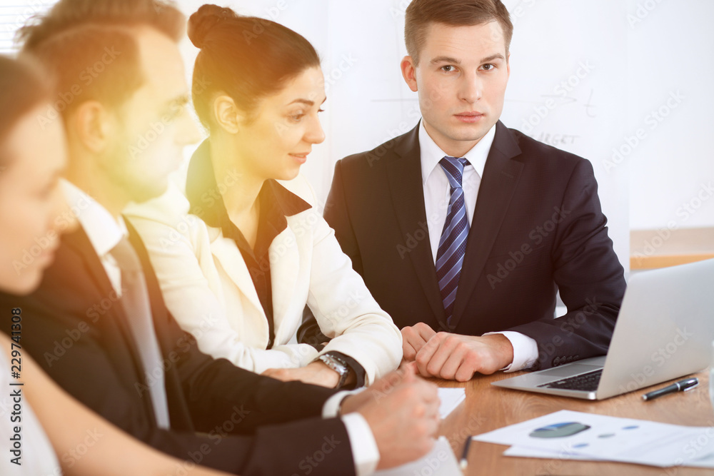 Business people at meeting in office background. Successful negotiation of business team or lawyers Business people at meeting in office background. Successful negotiation of business team or lawyers
