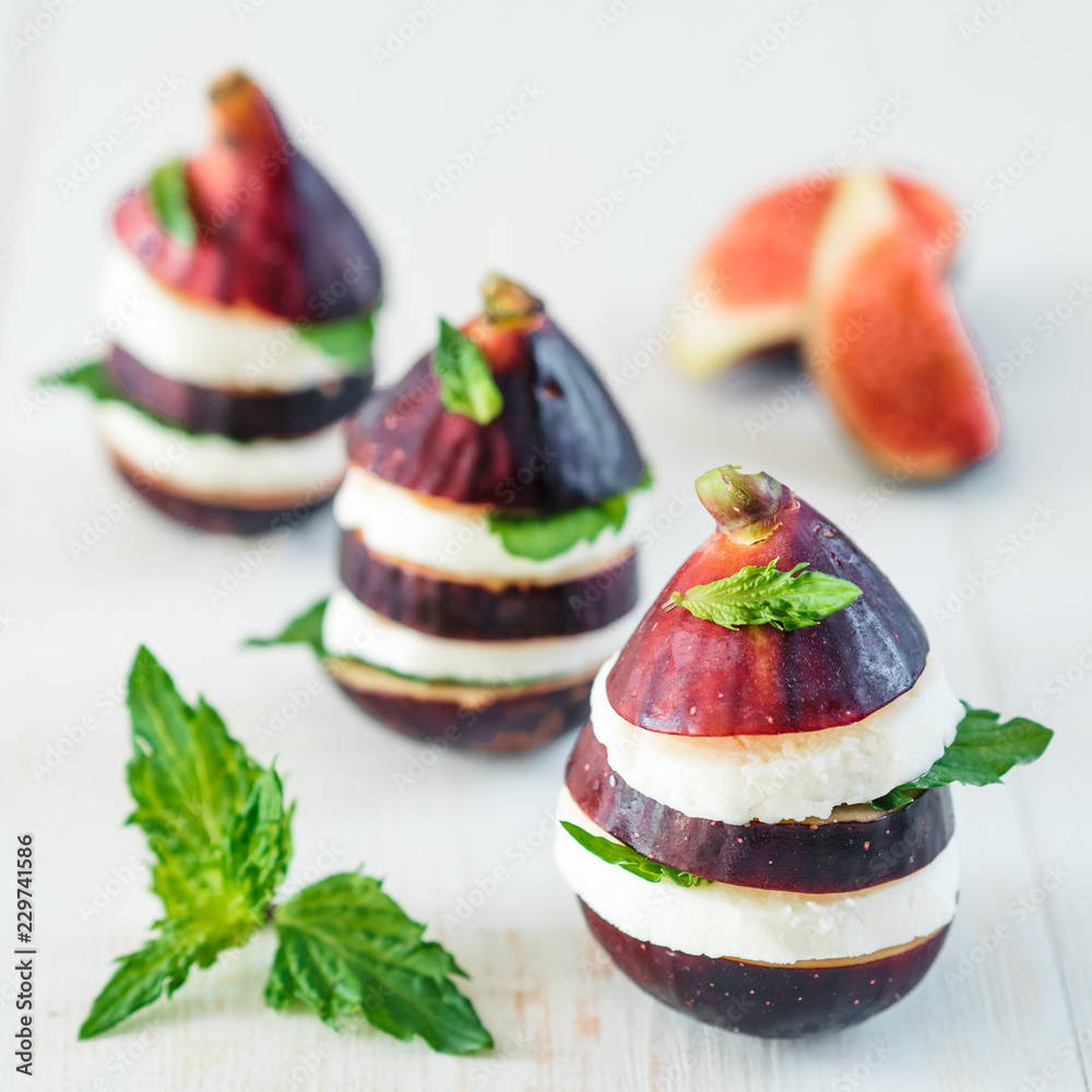 Ready to eat fun appetiezer with figs cheese purple basil mint