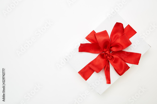single gift box with red ribbon