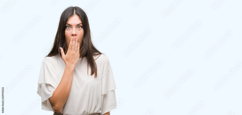 Young beautiful hispanic woman cover mouth with hand shocked with shame for mistake, expression of fear, scared in silence, secret concept Young beautiful hispanic woman cover mouth with hand shocked with shame for mistake, expression of fear, scared in silence, secret concept