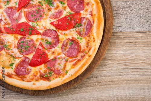 pizza with salami and red pepper