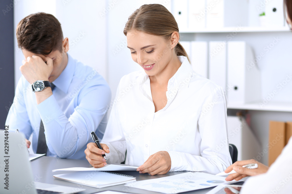 Group of business people or lawyers discussing terms of transaction in office. Meeting and teamwork concept Group of business people or lawyers discussing terms of transaction in office. Meeting and teamwork concept