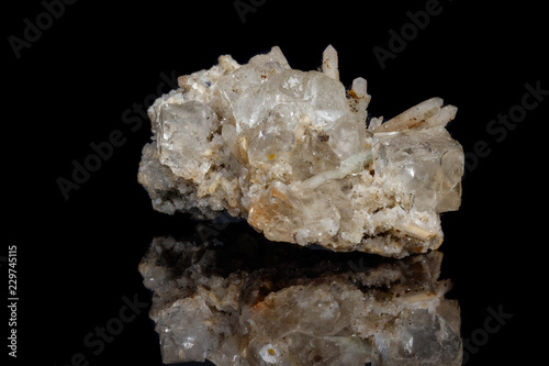 Macro mineral stone fluorite with quartz against black background