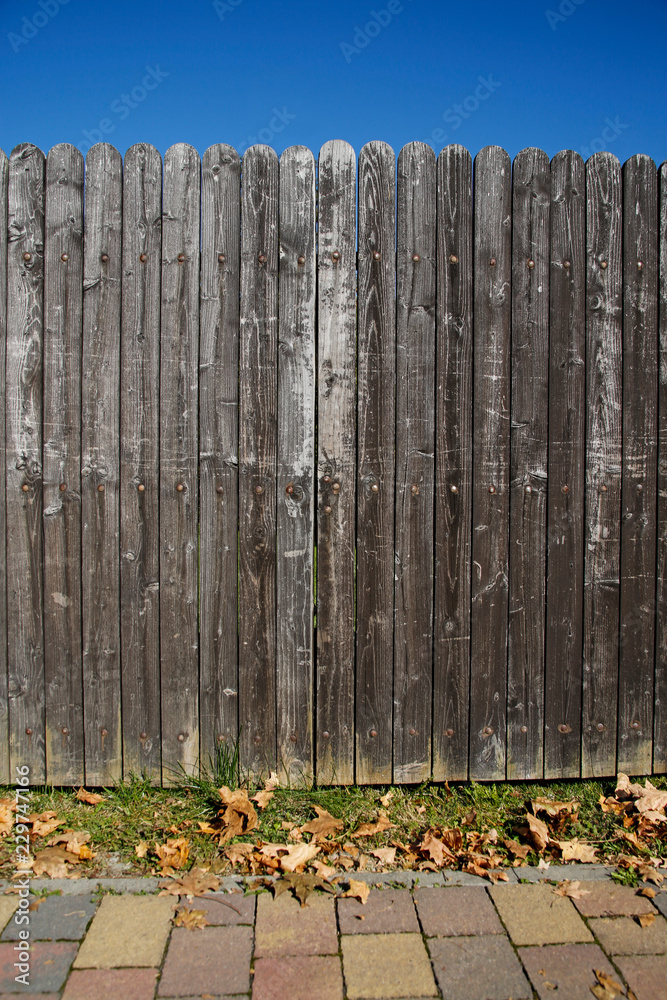 Fototapeta premium brown wooden gate in autumn scenery