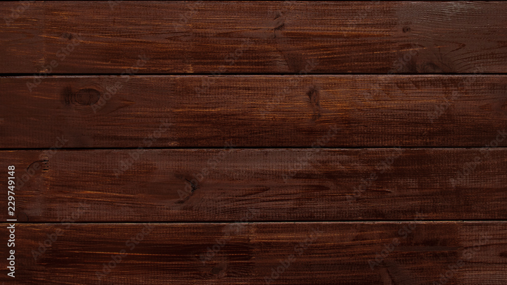 Naklejka premium dark wood board background