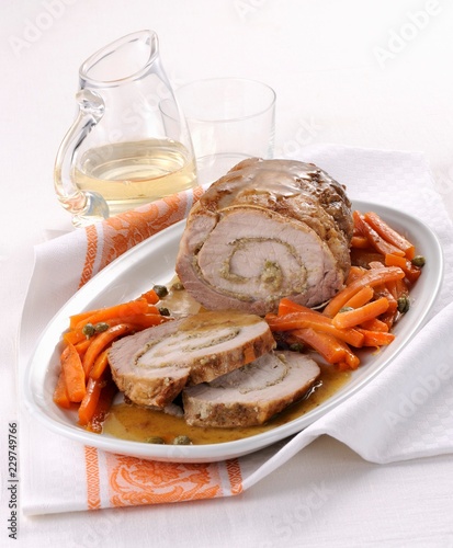Arrosto di maiale ai capperi (roast pork filled with capers, Italy) photo