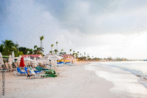 Fototapeta Naklejka Na Ścianę i Meble -  Idyllic caribbean tropical beach with white sand, turquoise ocean water before the rain
