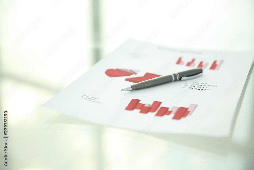 close up.financial chart and pen on light background close up.financial chart and pen on light background