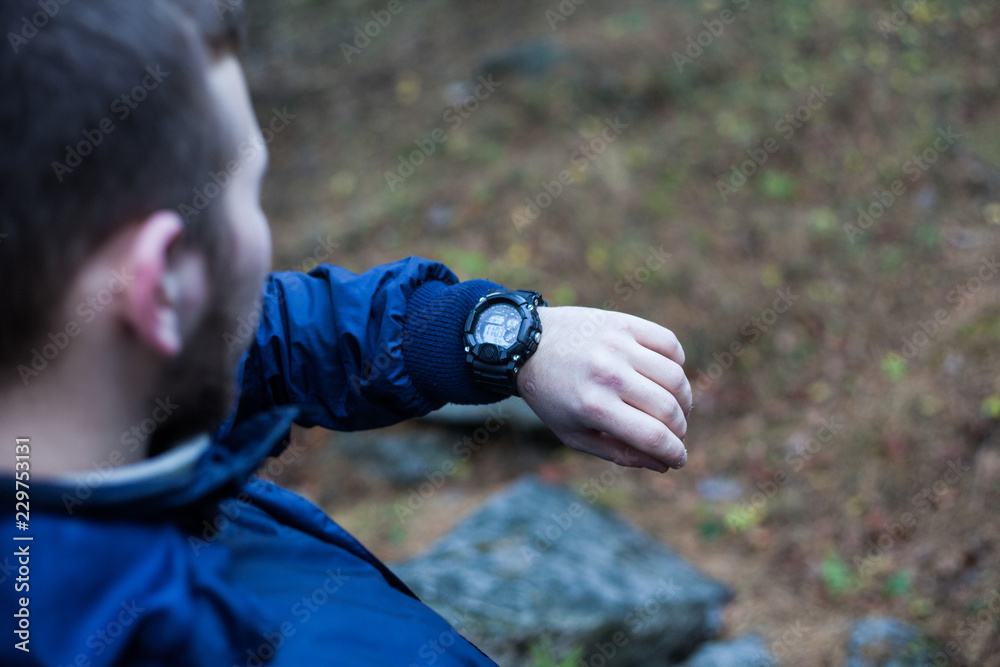 Fototapeta premium Man looking at his watch 