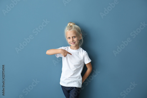 Cute little girl pointing a...