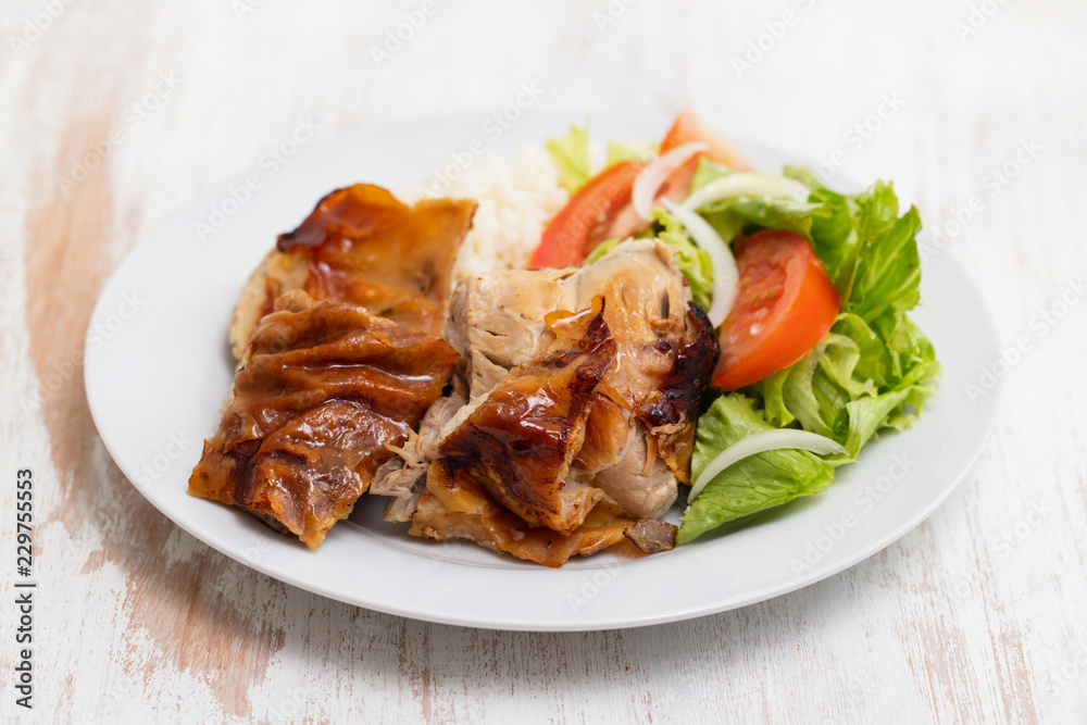 roasted pork with boiled rice and salad on white plate roasted pork with boiled rice and salad on white plate