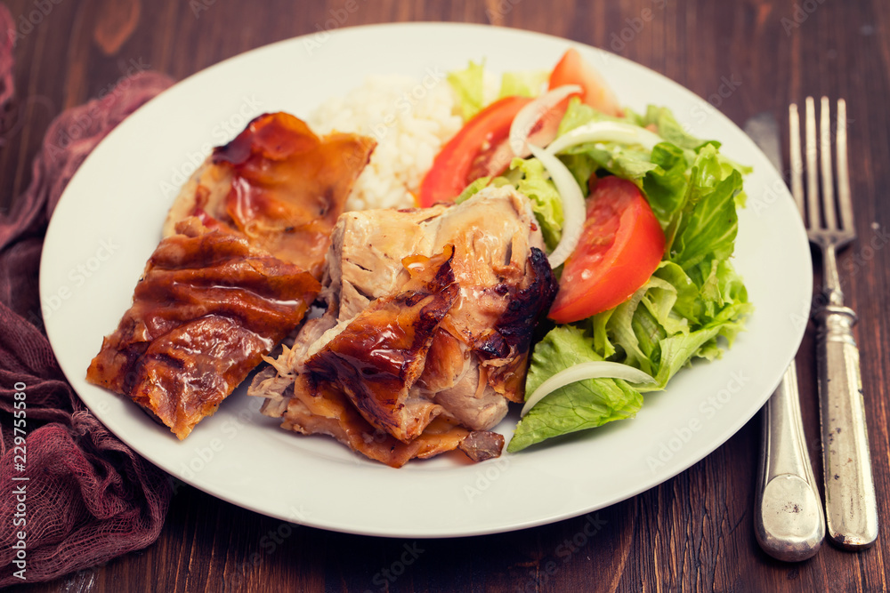 roasted pork with boiled rice and salad on white plate roasted pork with boiled rice and salad on white plate