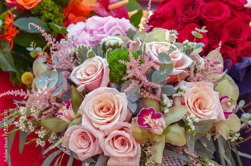 Bouquet of pink roses and other flowers.