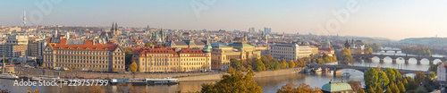 Prague - The panorama of the city with the bridges in evening light.