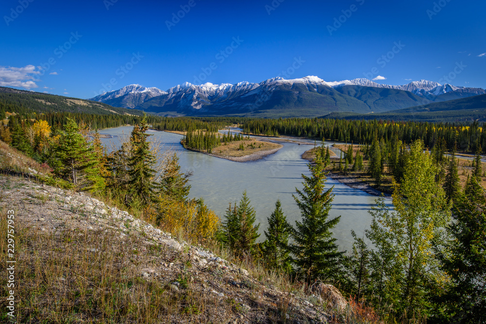 Beautiful River View in British Columbia over the mountains covered with clouds