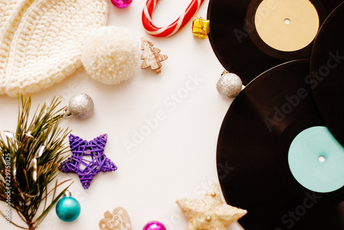 Christmas composition. Christmas decorations, hat and vinyl on white background. Flat lay, top view