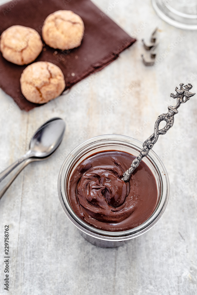 Fototapeta premium homemade vegan chocolate cream with almond butter, cocoa, sugar, rum, amaretti biscuit (italian almond biscuit)