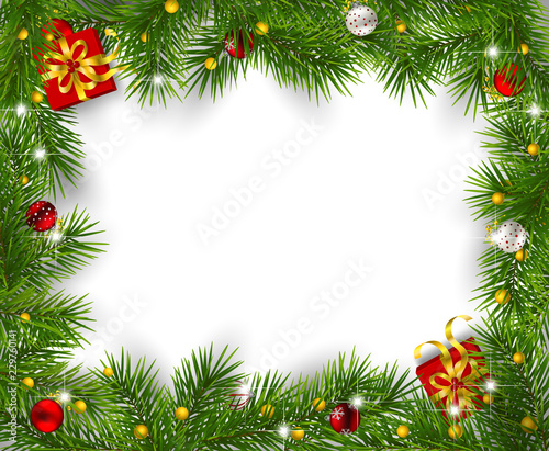 Frame of fir branches decorated with baubles and gifts on white background. Christmas background with space for text.