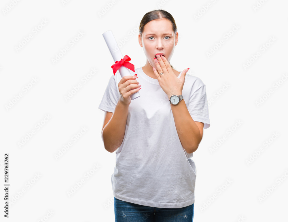 Young caucasian woman holding degree over isolated background cover mouth with hand shocked with shame for mistake, expression of fear, scared in silence, secret concept Young caucasian woman holding degree over isolated background cover mouth with hand shocked with shame for mistake, expression of fear, scared in silence, secret concept