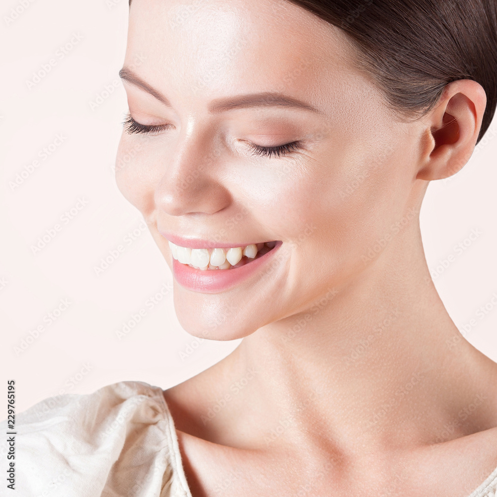 Young smiling woman with clean perfect skin close-up Young smiling woman with clean perfect skin close-up