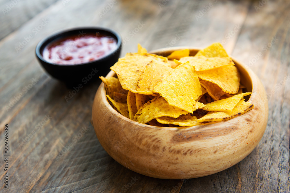 Chips in basket - Mexican chips in a basket on table Chips in basket - Mexican chips in a basket on table