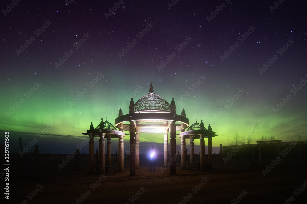 Obraz premium Aurora display in Yakutsk. The polar Northern lights aurora borealis sky star in Yakutia, Siberia, in place of the cult summer festivity Yhyakh Tuymaady of Yakuts, of the people of Yakutia
