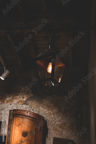 Old rusty lamp in an old italian restaurant