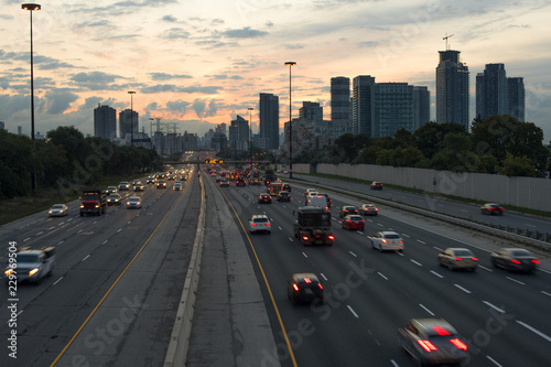 Highway in Toronto Ontario with tail lights at dawn