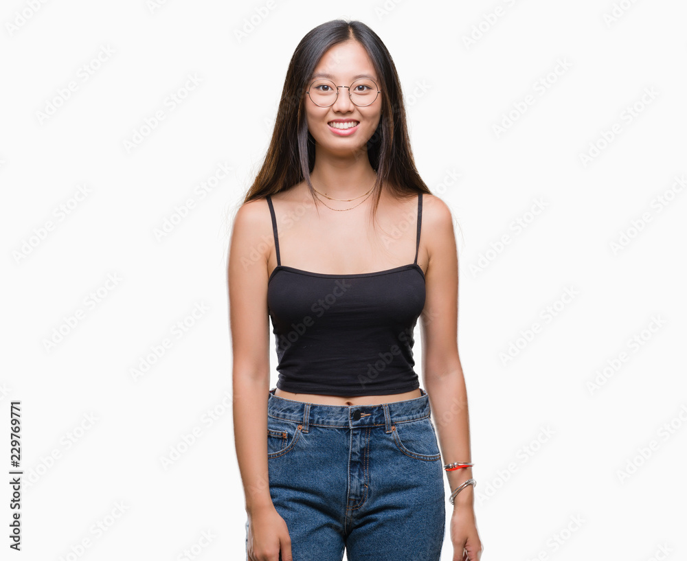 Young asian woman wearing glasses over isolated background with a happy and cool smile on face. Lucky person. Young asian woman wearing glasses over isolated background with a happy and cool smile on face. Lucky person.