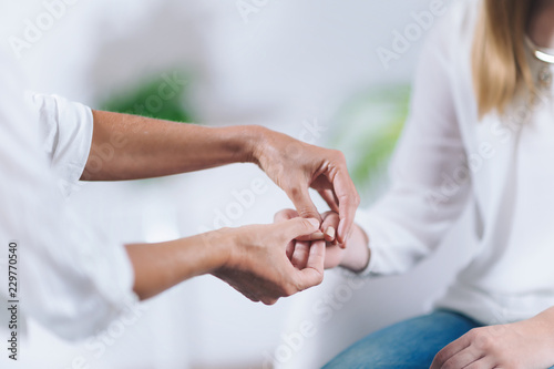 Canvastavla Close-Up Of Women Holding Hands At Theta Healing Session