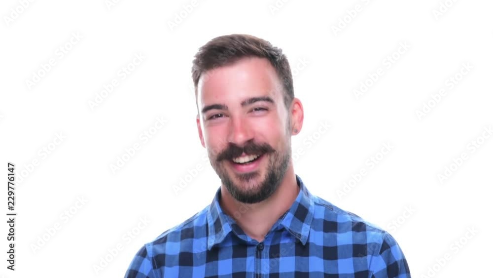 Happy young spontaneous carefree laughing charming man looking at camera isolated on white background. Happy young spontaneous carefree laughing charming man looking at camera isolated on white background.