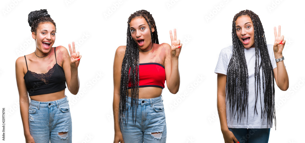 Young braided hair african american girl wearing winter sweater over isolated background gesturing with hands showing big and large size sign, measure symbol. Smiling looking at the camera