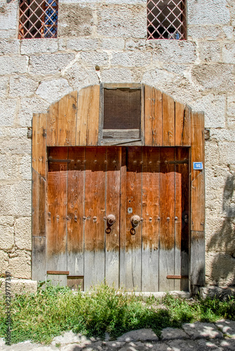 Karabuk, Turkey, 22 May 2013: Historic Mansions Door with Woman, Yoruk Village of Safranbolu photo