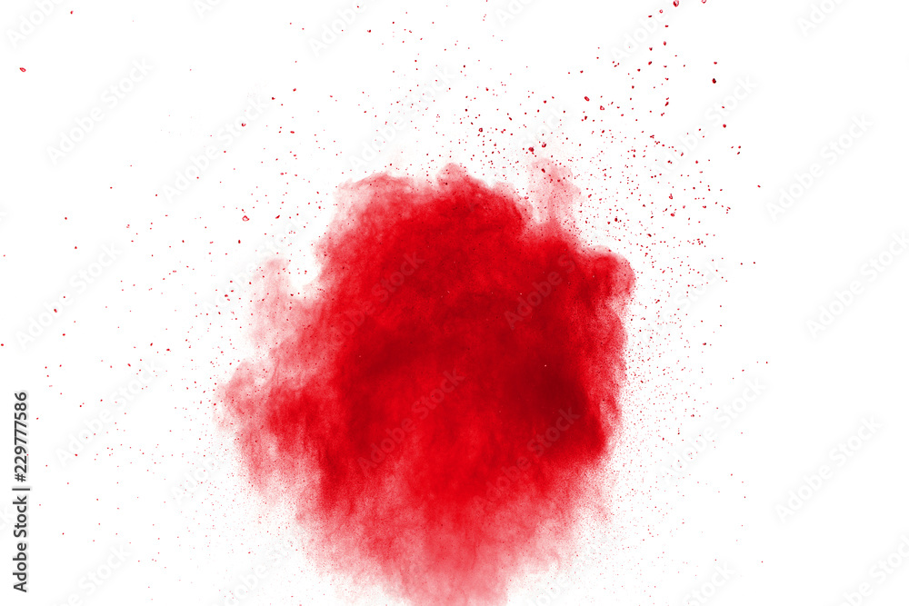 abstract red dust splattered on white background. Red powder explosion.Freeze motion of red particles splashing.