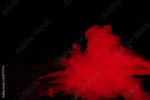 red color powder explosion cloud on black background
