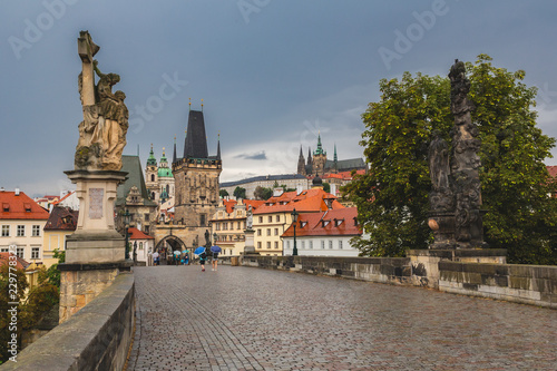 Rainy day view over Charles bridge in Prague. Perfect day for umbrella sightseeing