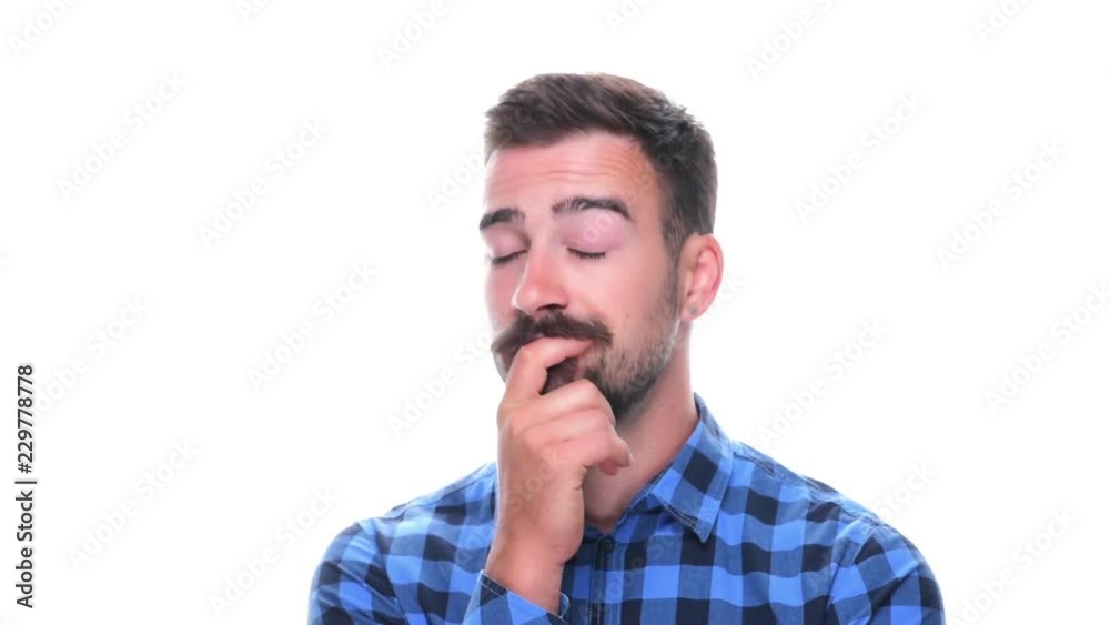 Young worried bearded man thinking scratching hair and looking around isolated on white background. Young worried bearded man thinking scratching hair and looking around isolated on white background.