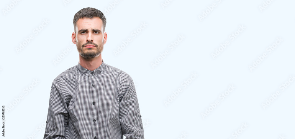 Young hipster man depressed and worry for distress, crying angry and afraid. Sad expression. Young hipster man depressed and worry for distress, crying angry and afraid. Sad expression.