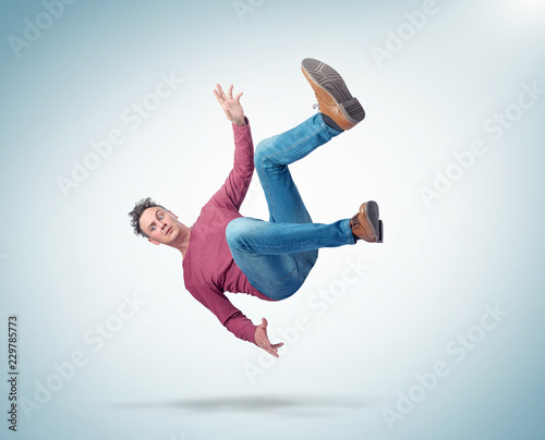 Tableau sur toile Situation, the man in casual clothes is falling