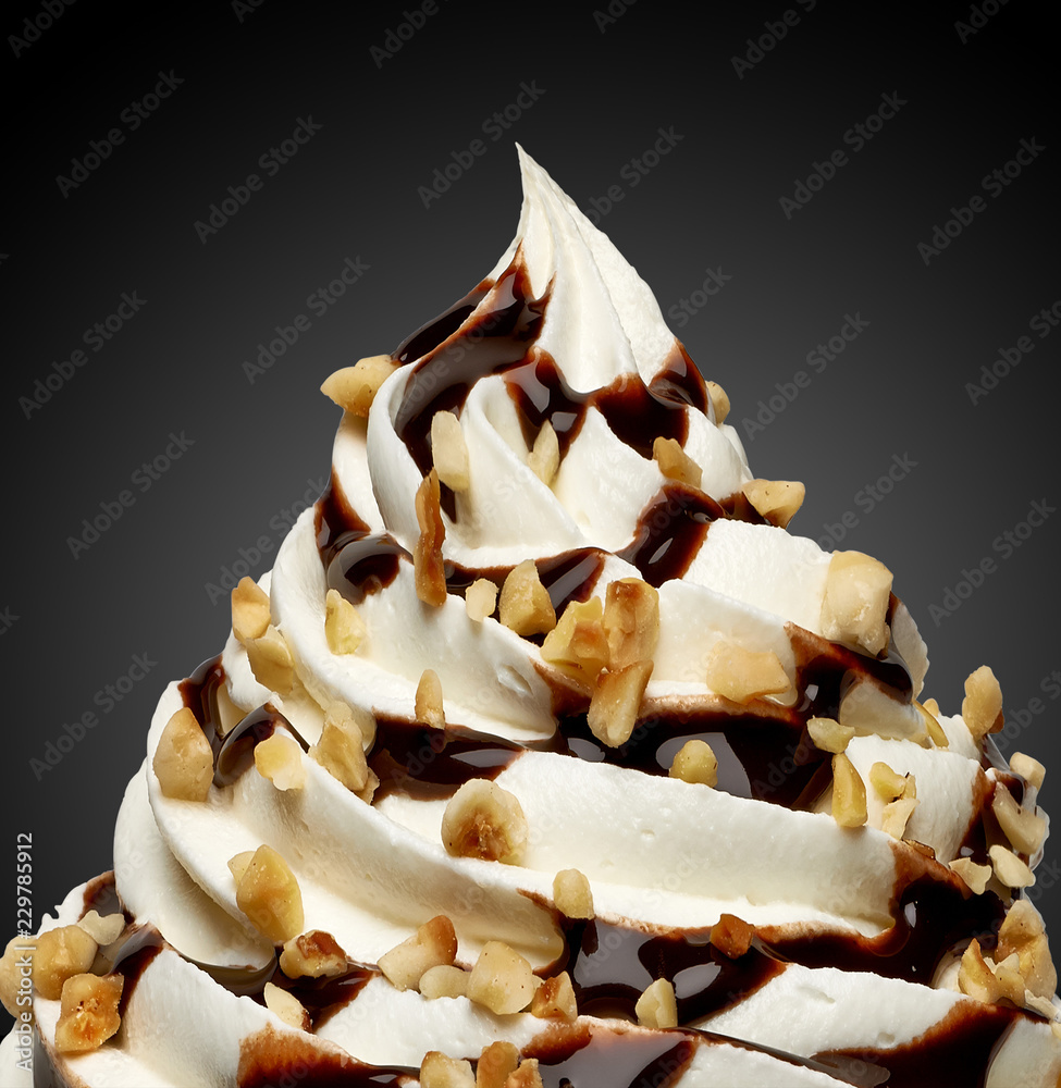Whipped cream, frozen yogurt or soft ice cream with chocolate sauce and