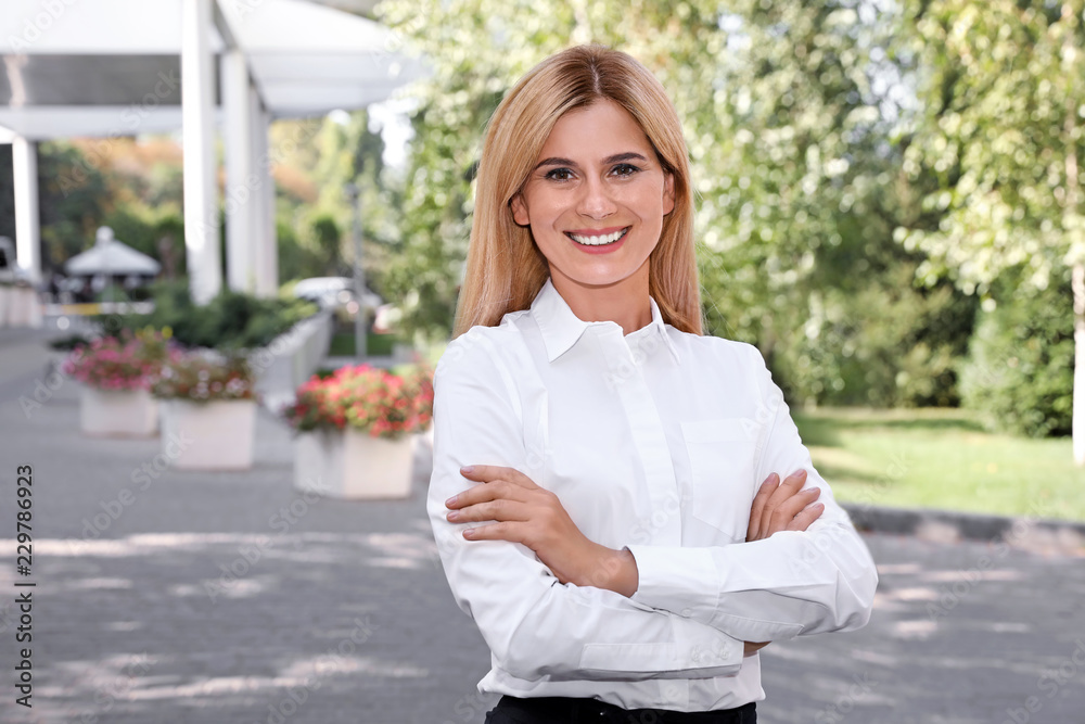 Beautiful businesswoman outdoors. Real estate agent Beautiful businesswoman outdoors. Real estate agent
