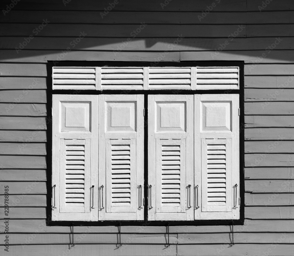 Fototapeta premium wood window at wood antique house in southeast asia - thailand. - monochrome