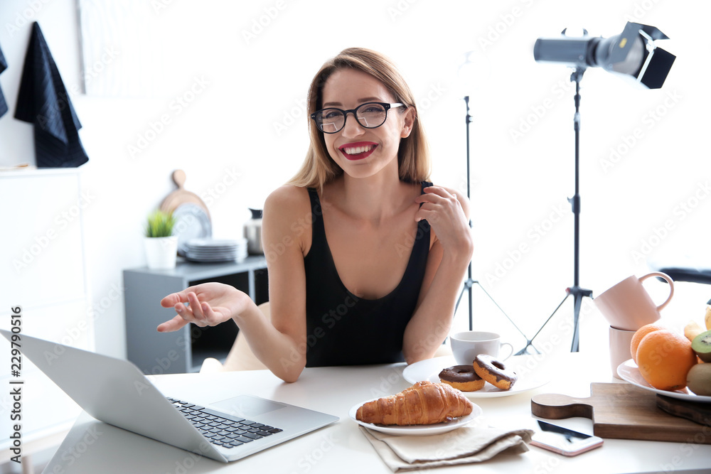 Portrait of food blogger with laptop at home Portrait of food blogger with laptop at home
